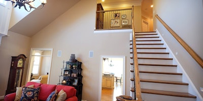 Light gray walls, large vaulted ceilings and long staircase - Residential painting