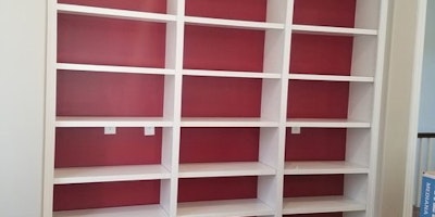 White shelves with red wall - Residential painting by Nash Painting Nashville TN