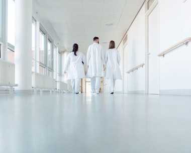 People in a hallway of a medical facility